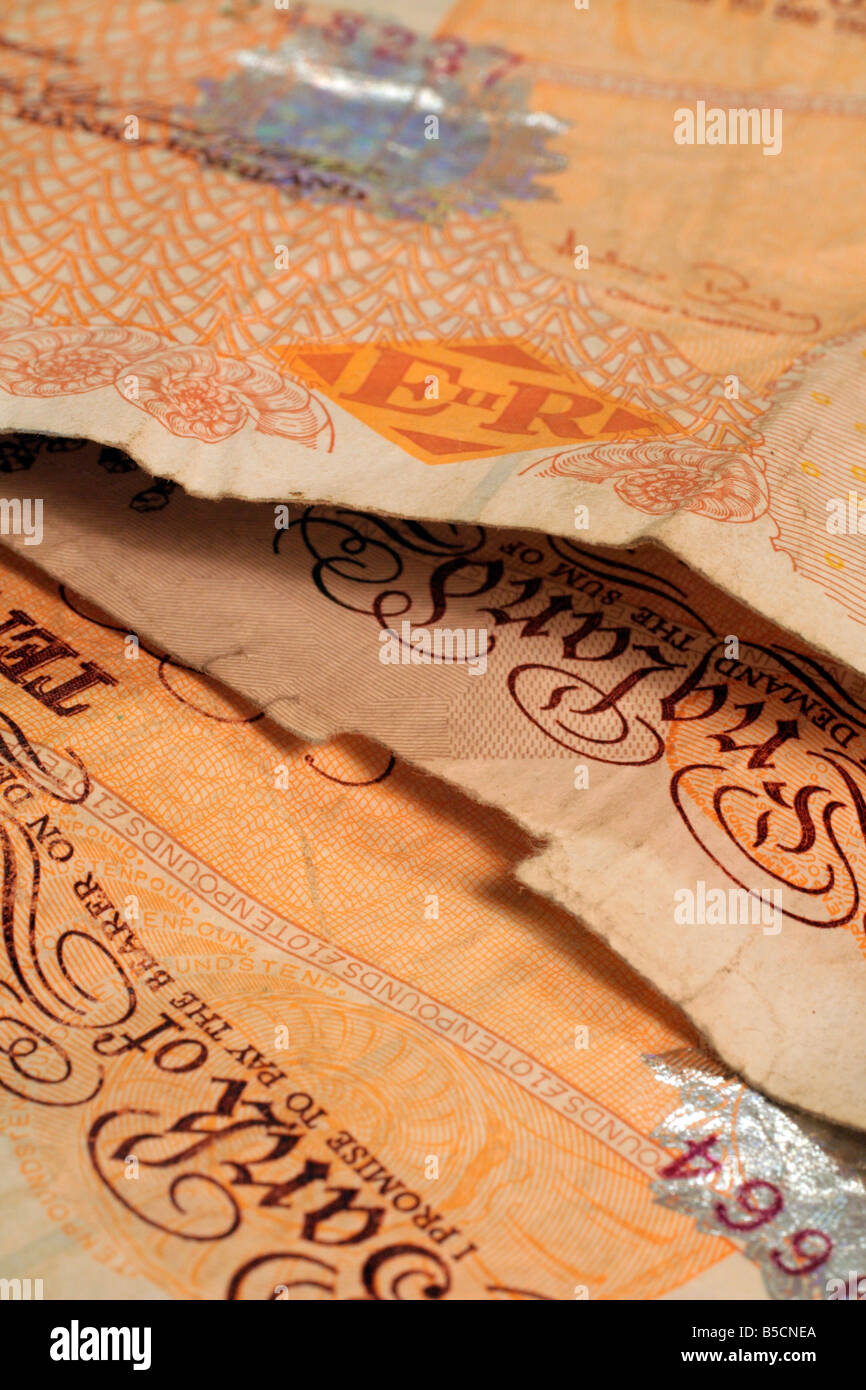 Old Ten pound notes still in circulation frayed torn and dirty at the edges Stock Photo