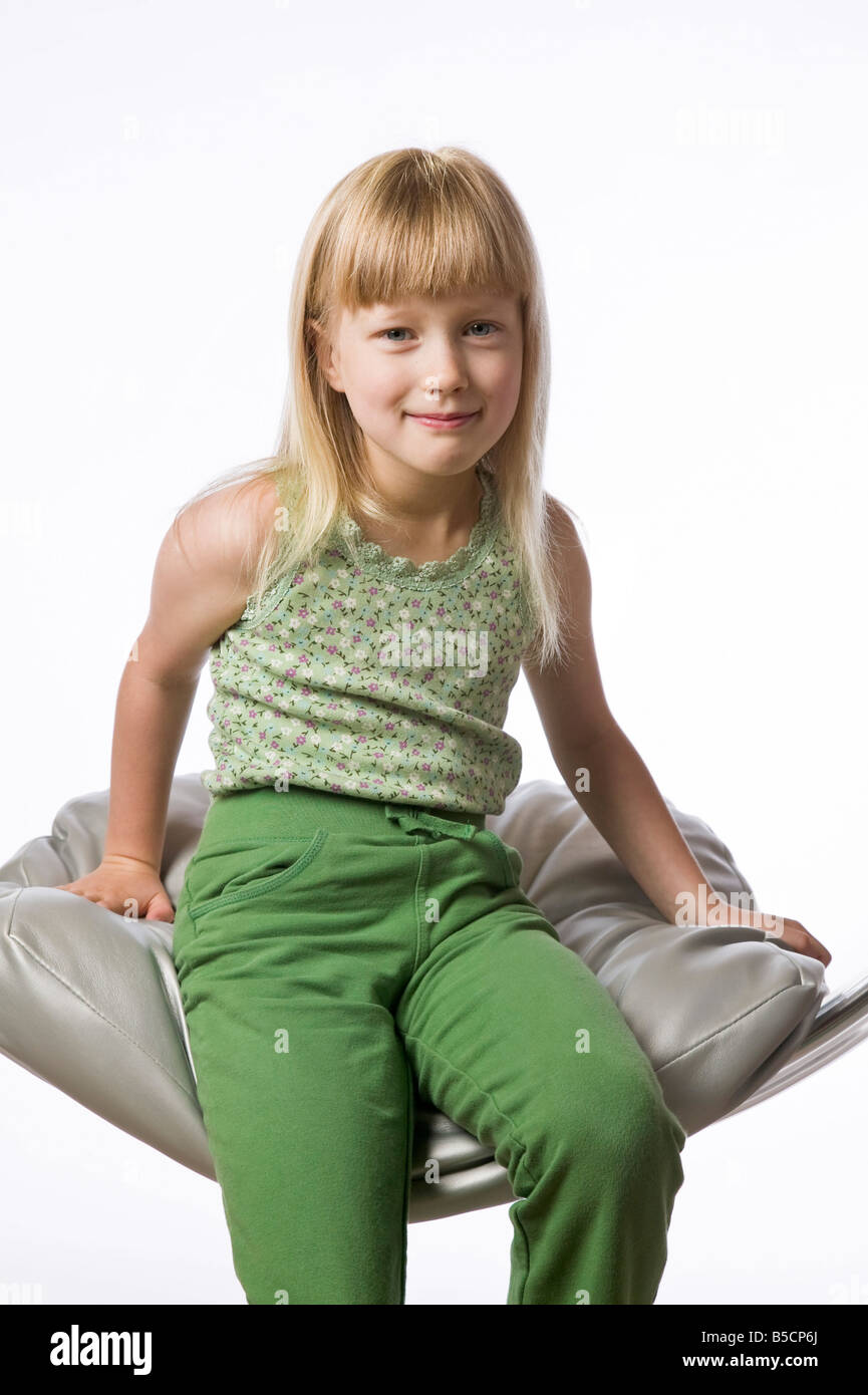 Portrait of a young girl against white background Stock Photo - Alamy