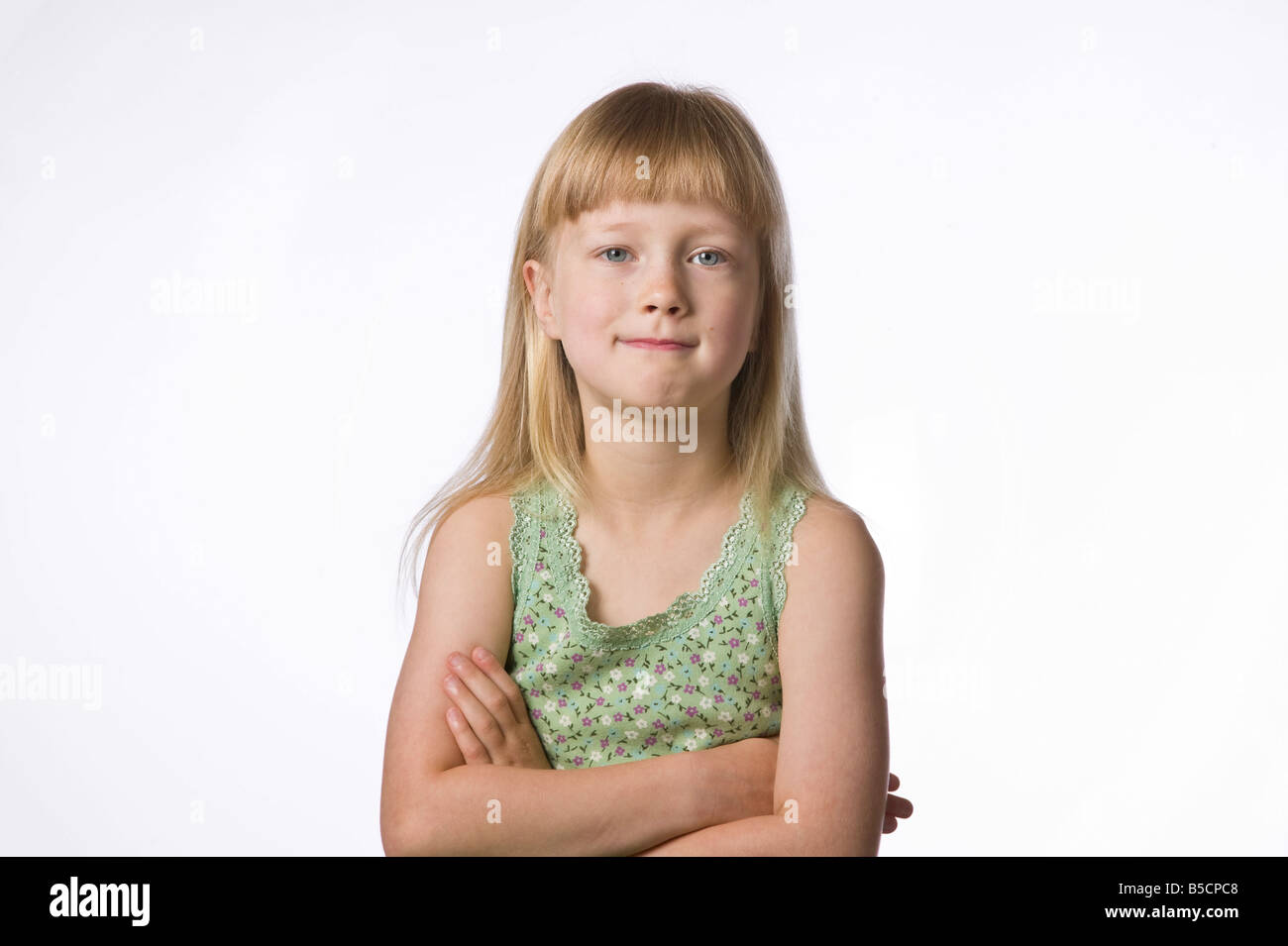 Portrait of a young girl against white background Stock Photo - Alamy