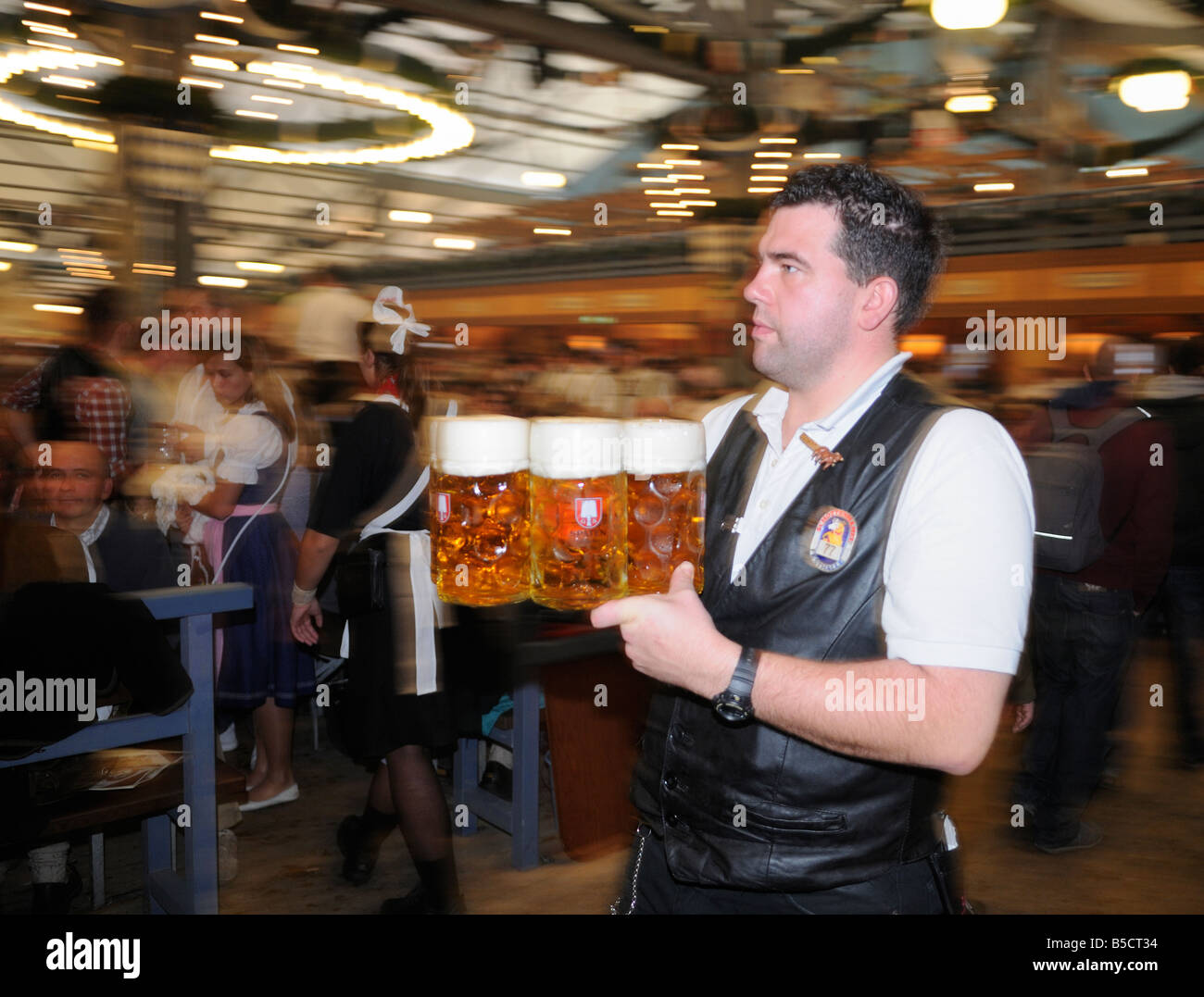 Waiter carrying beer hi-res stock photography and images - Alamy