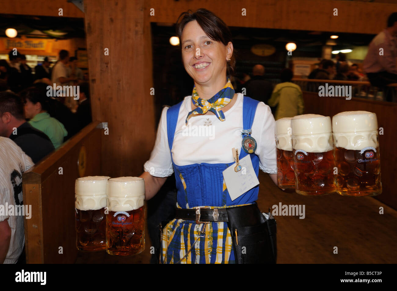 Oktoberfest waitress carrying beers Stock Photo Alamy