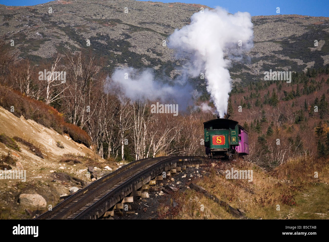 The steam engine of the cog railway is seen on its descent down Mount Washington in New Hampshire, USA. Stock Photo