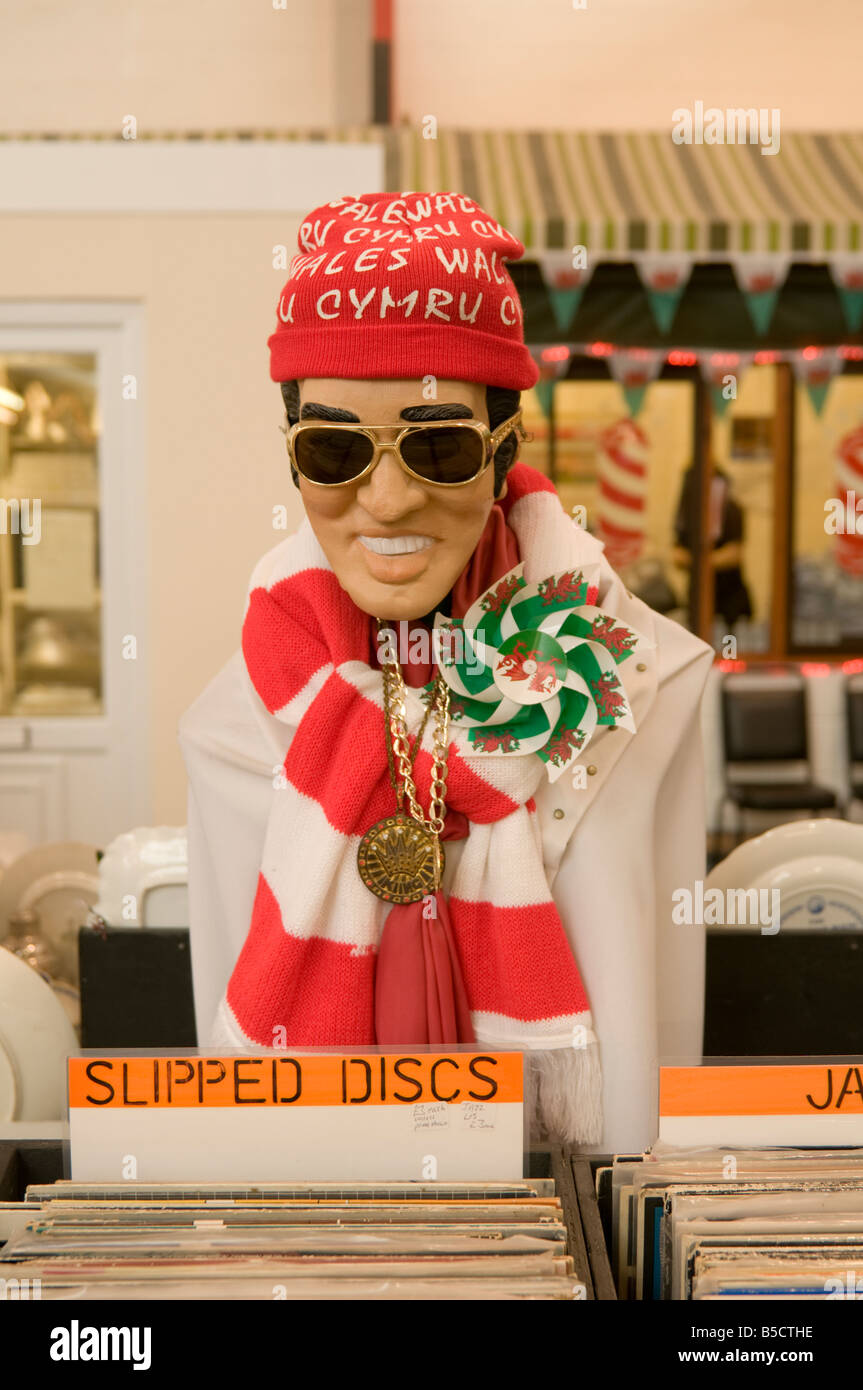 Elvis Presley figure dressed in welsh national memorabilia on "Slipped Discs" record stall in Carmarthen indoor market, Wales UK Stock Photo