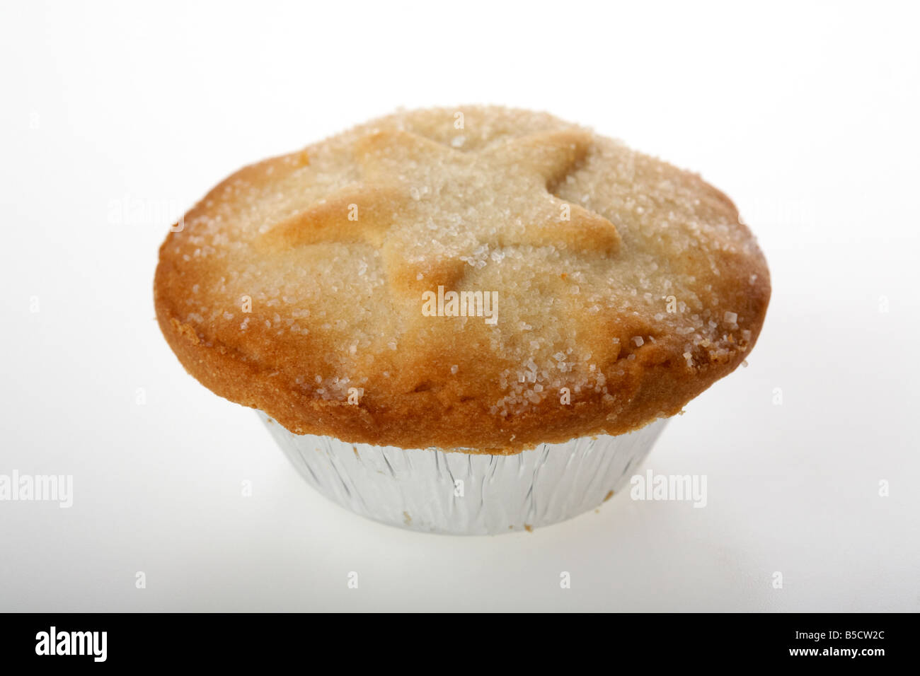 small mince pie in a metal aluminium foil container commonly eaten in the UK at christmas Stock Photo