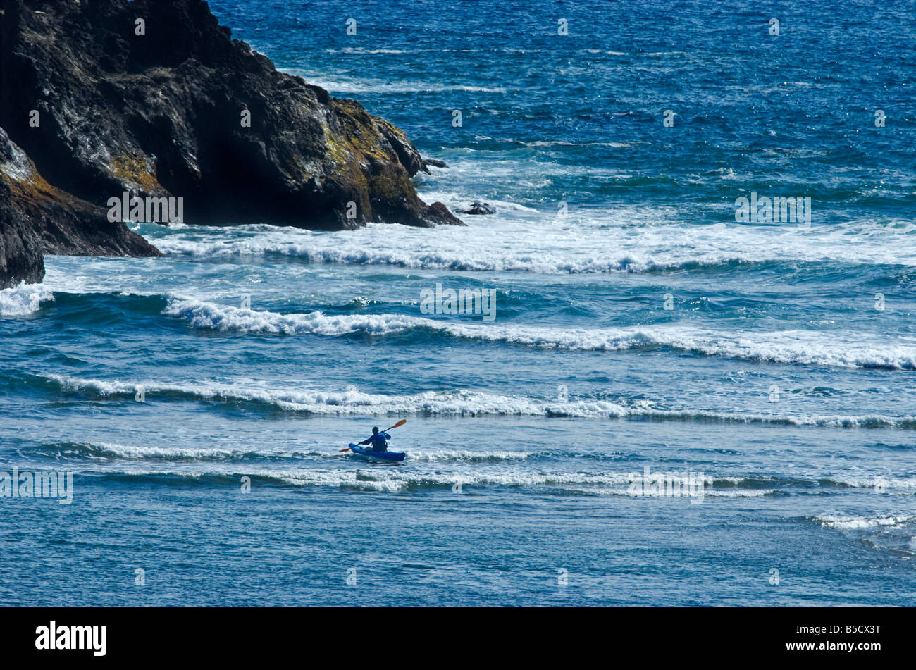Person in kayak off the Northern California Coast in Pacific Ocean Stock Photo