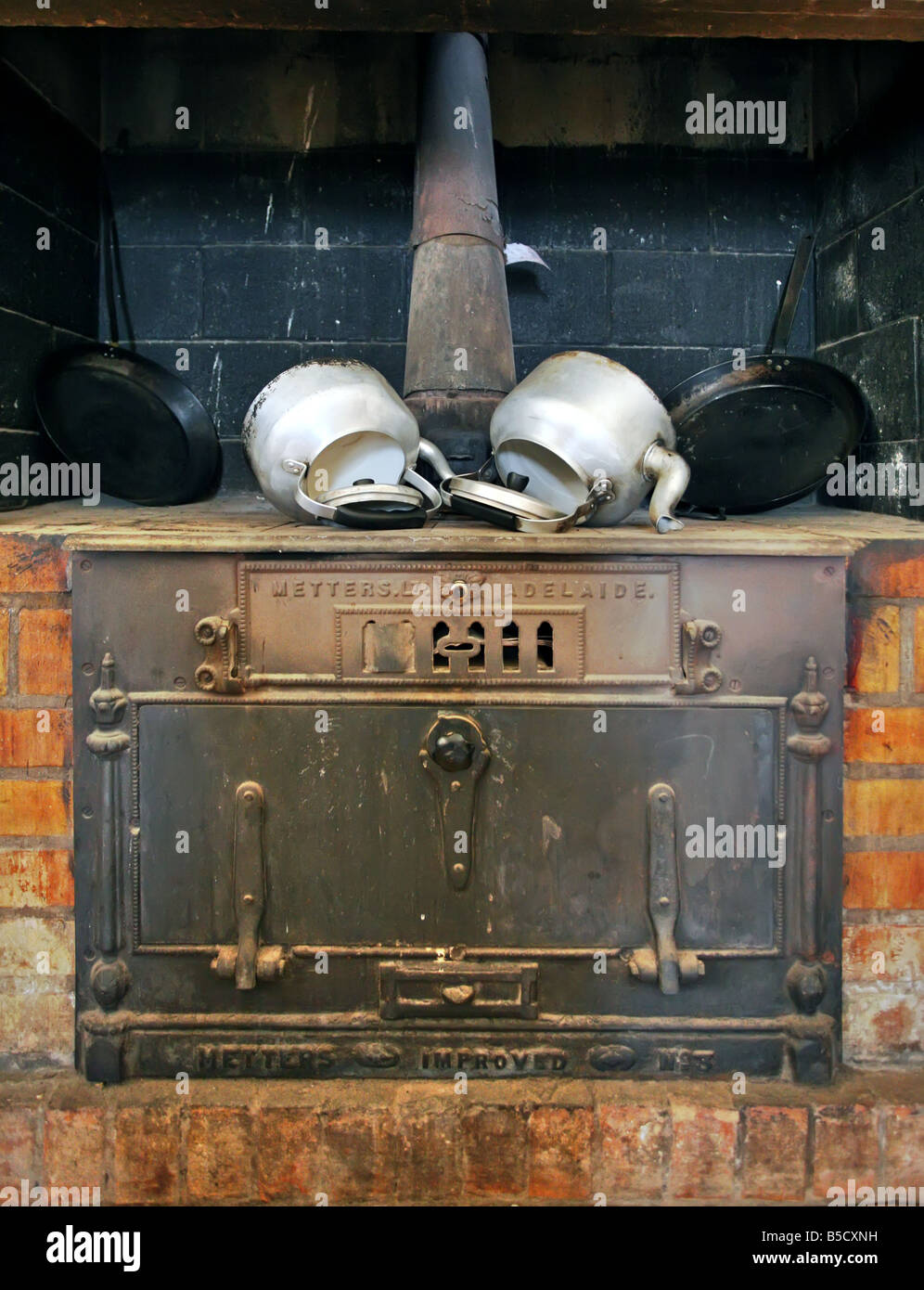 Wood fired stove and kettles Stock Photo Alamy