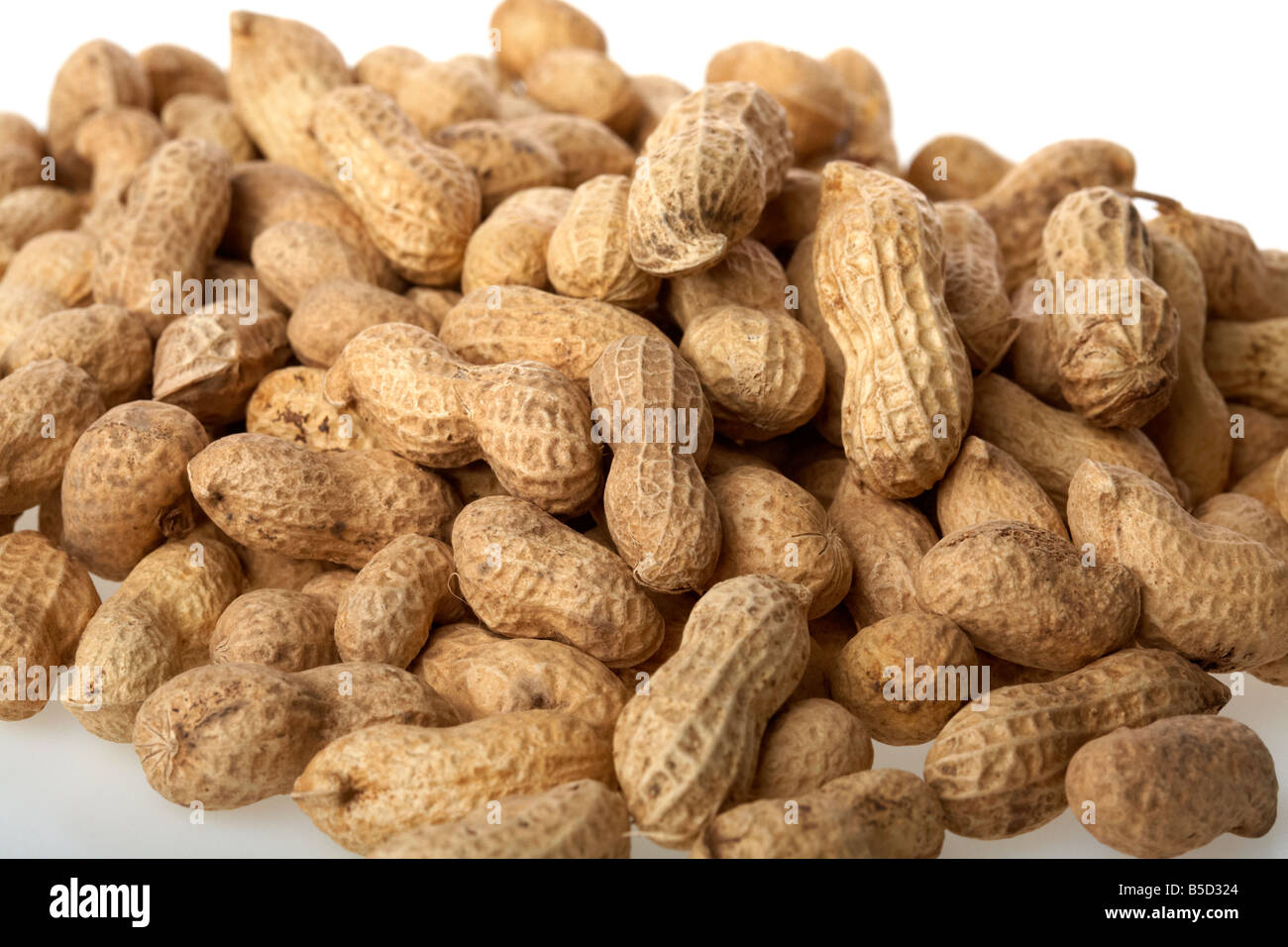 pile of peanuts in their shells Stock Photo