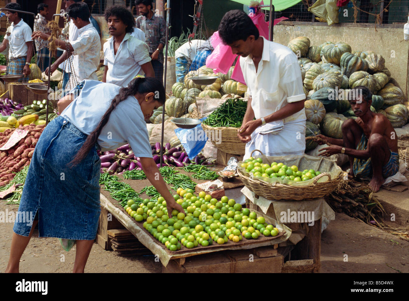 Market vendor selling limes main market area Kandy Sri Lanka Asia Stock
