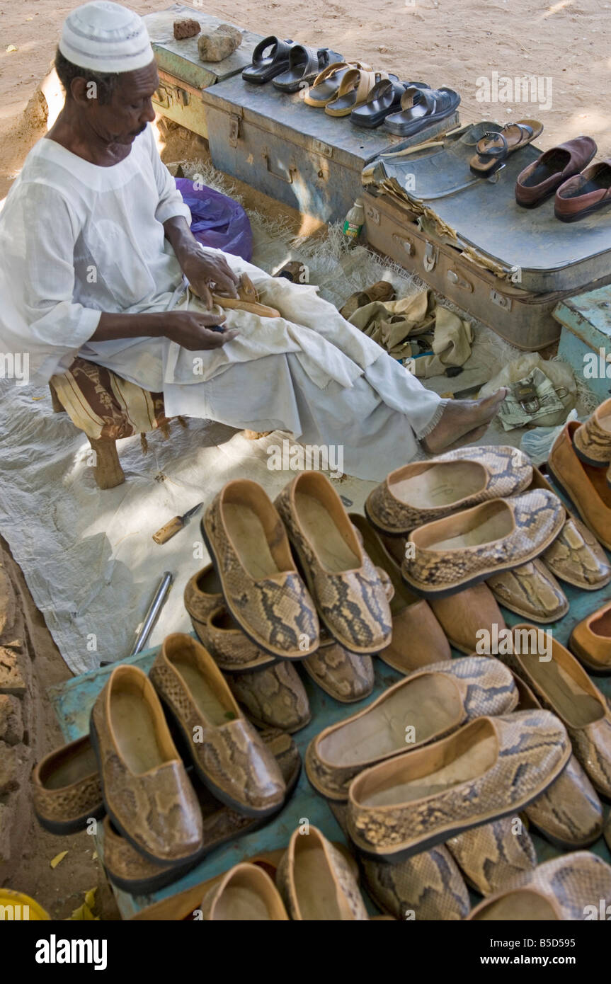 Street cobbler in Karima a northern Sudanese market town, Sudan, Africa Stock Photo