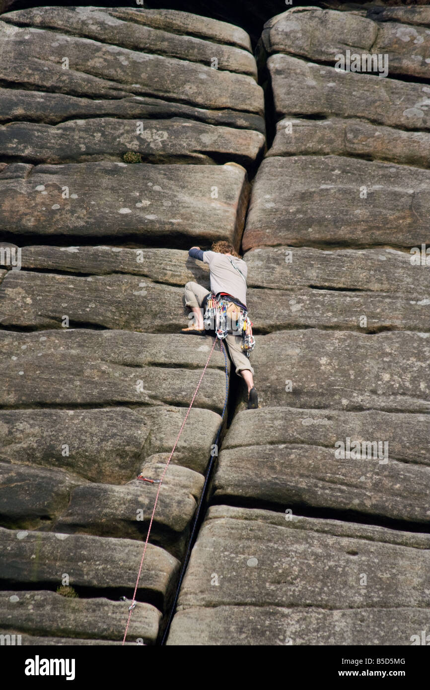 Climber on crack in rock Stock Photo