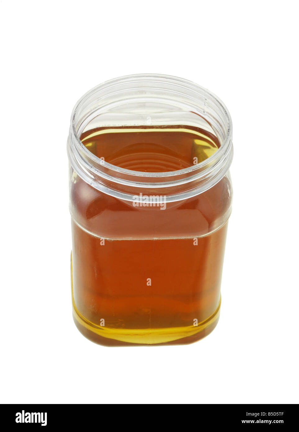 open jar of honey on white background Stock Photo Alamy