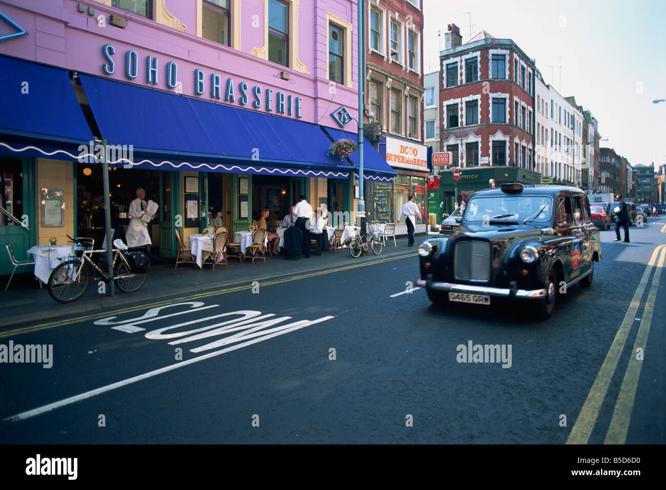 Taxi on Old Compton Street Soho London England UK L Murray Stock Photo