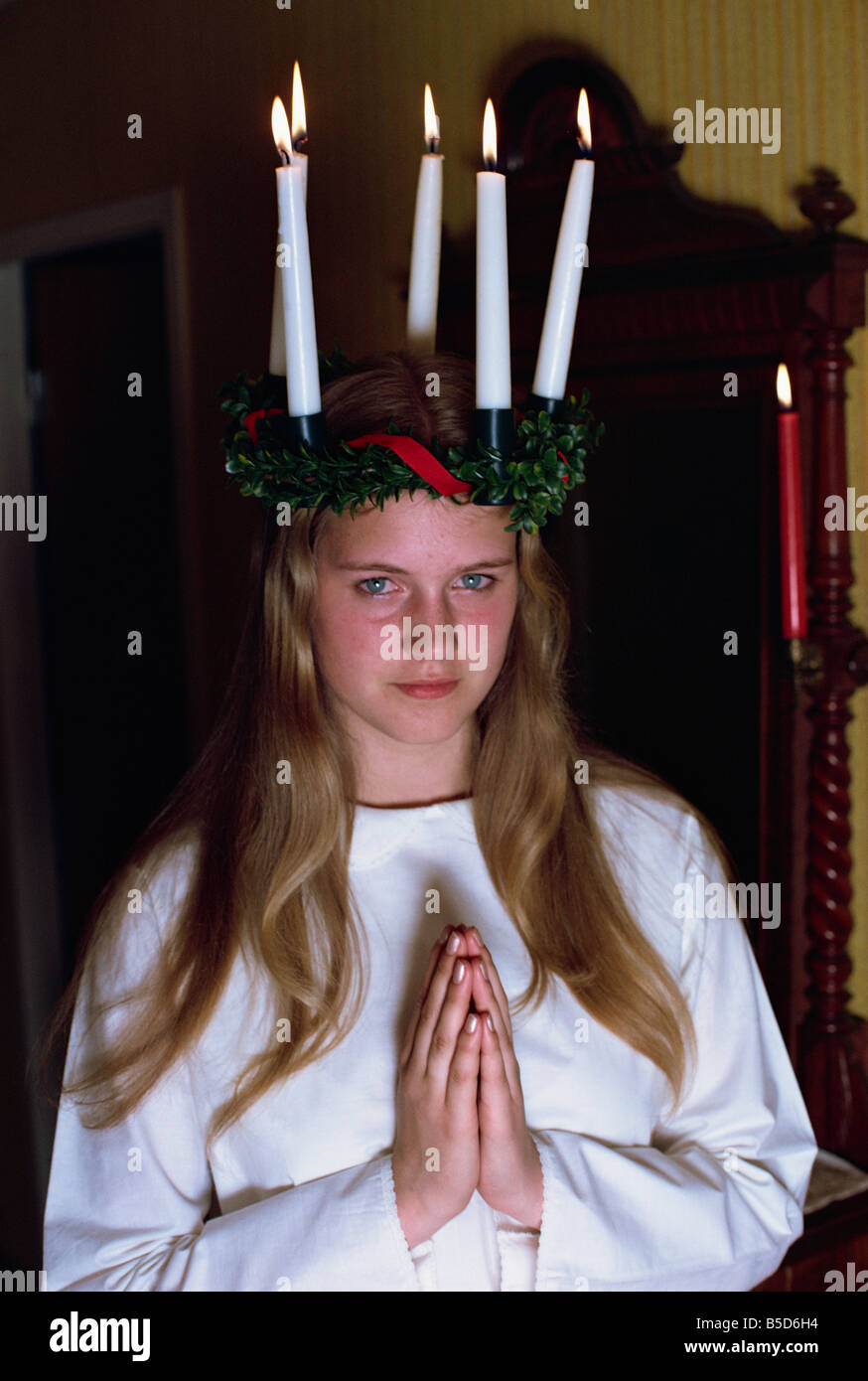 Teenage girl praying in traditional costume, for Santa Lucia Day 13,  Gothenburg, Sweden, Scandinavia Stock Photo - Alamy