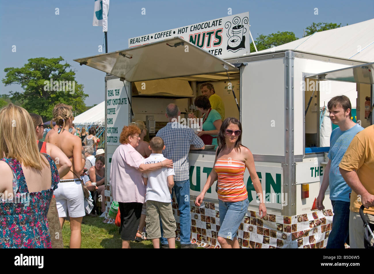 Outdoor Fast Food Outlet Refreshment Stall and People queuing Customers Stock Photo