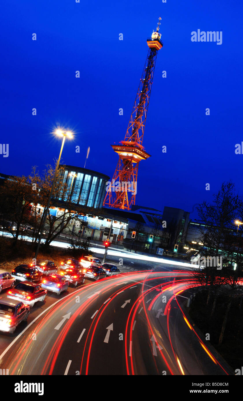 The Berlin Funkturm and busy street in the evening, Germany Stock Photo