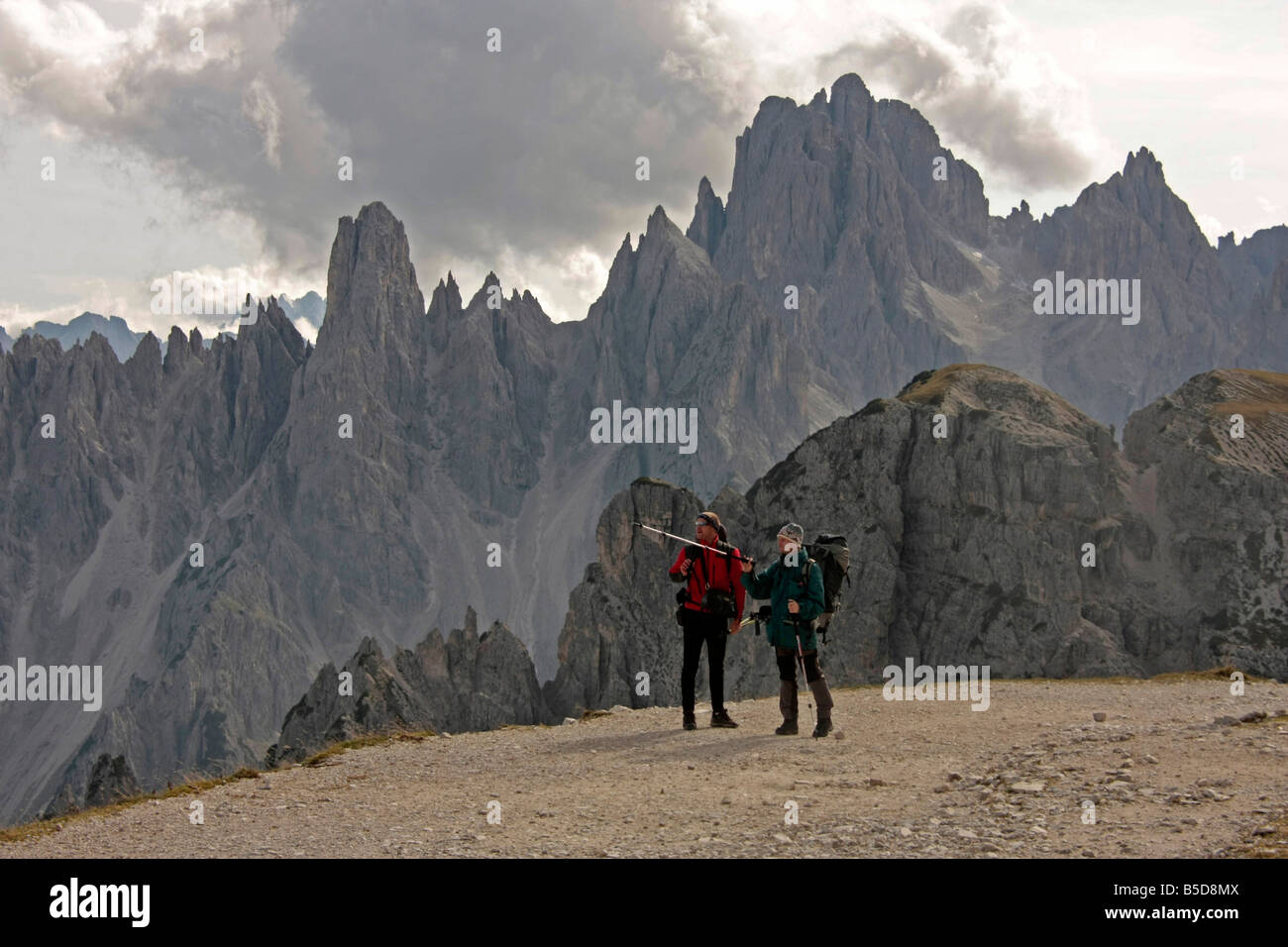 Hikers in the Sexten Dolomites around the Tre Cime di Lavaredo or three peaks of Lavaredo near Toblach in northeastern Italy Stock Photo