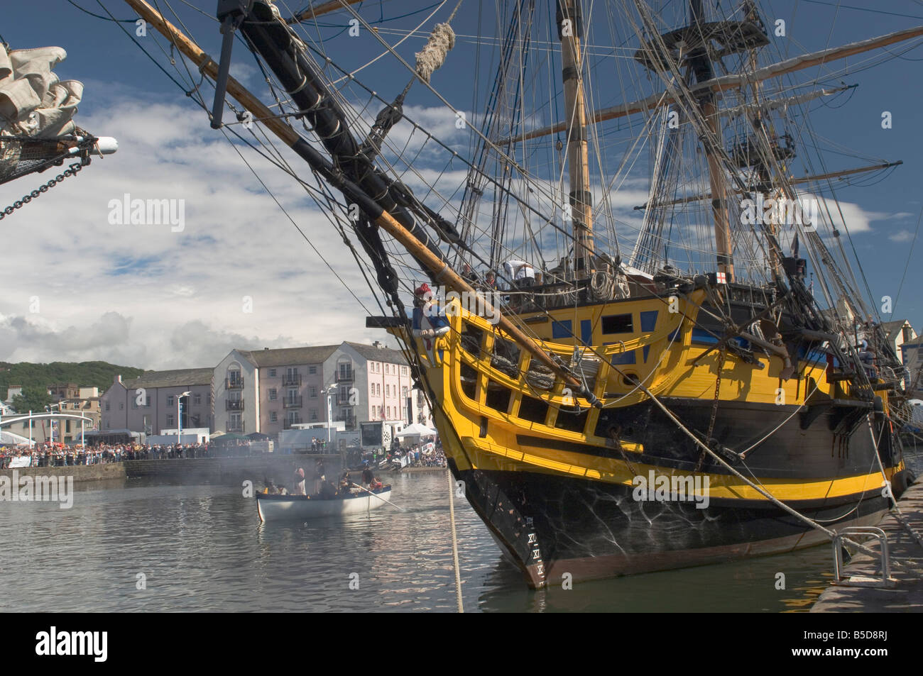 Tall ship Grand Turk, moored in inner harbour, with long boat in