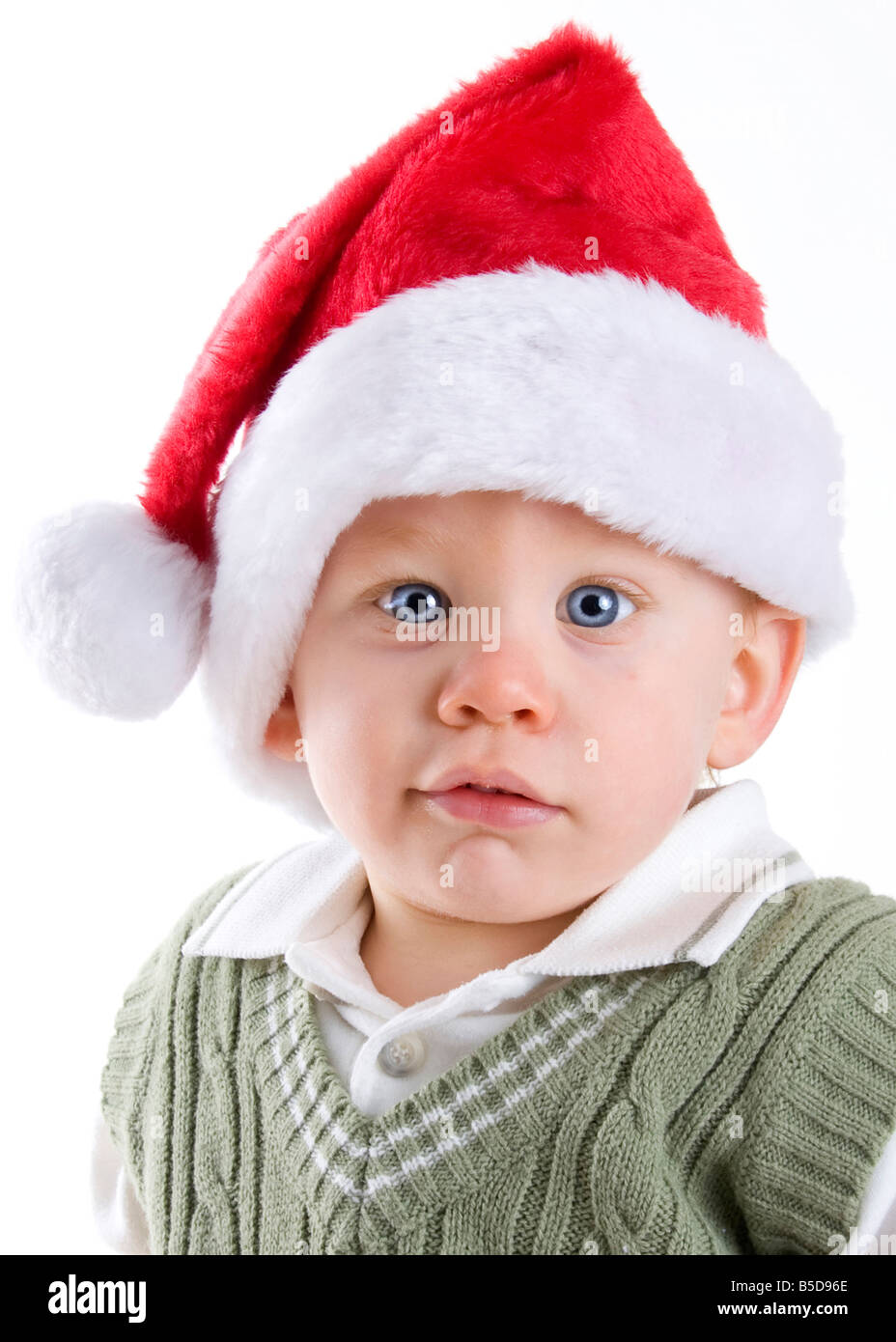 Handsome young child wearing a red santa claus hat Stock Photo - Alamy