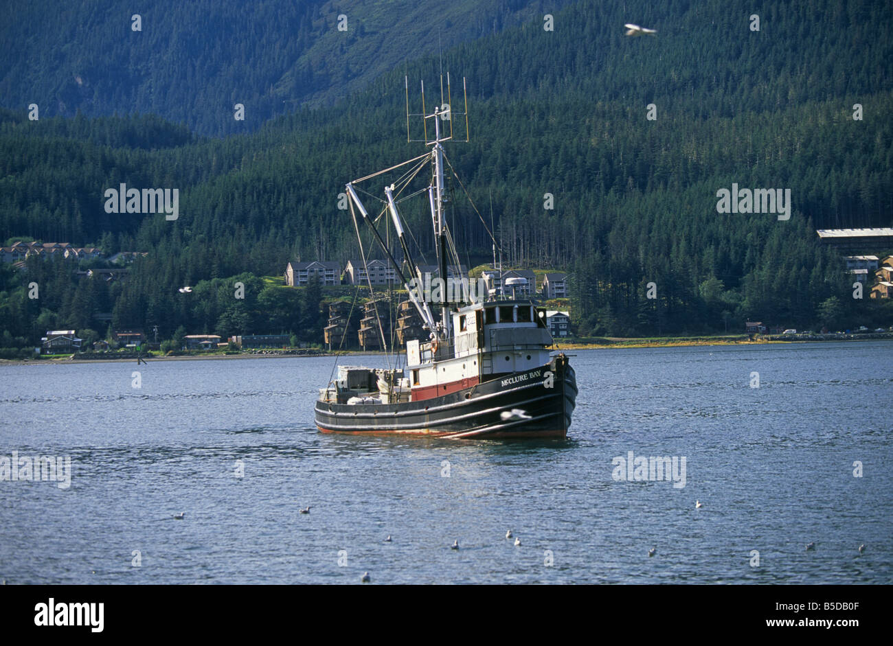 A fishing boat heads for the Inside Passage as it leaves the Juneau ...