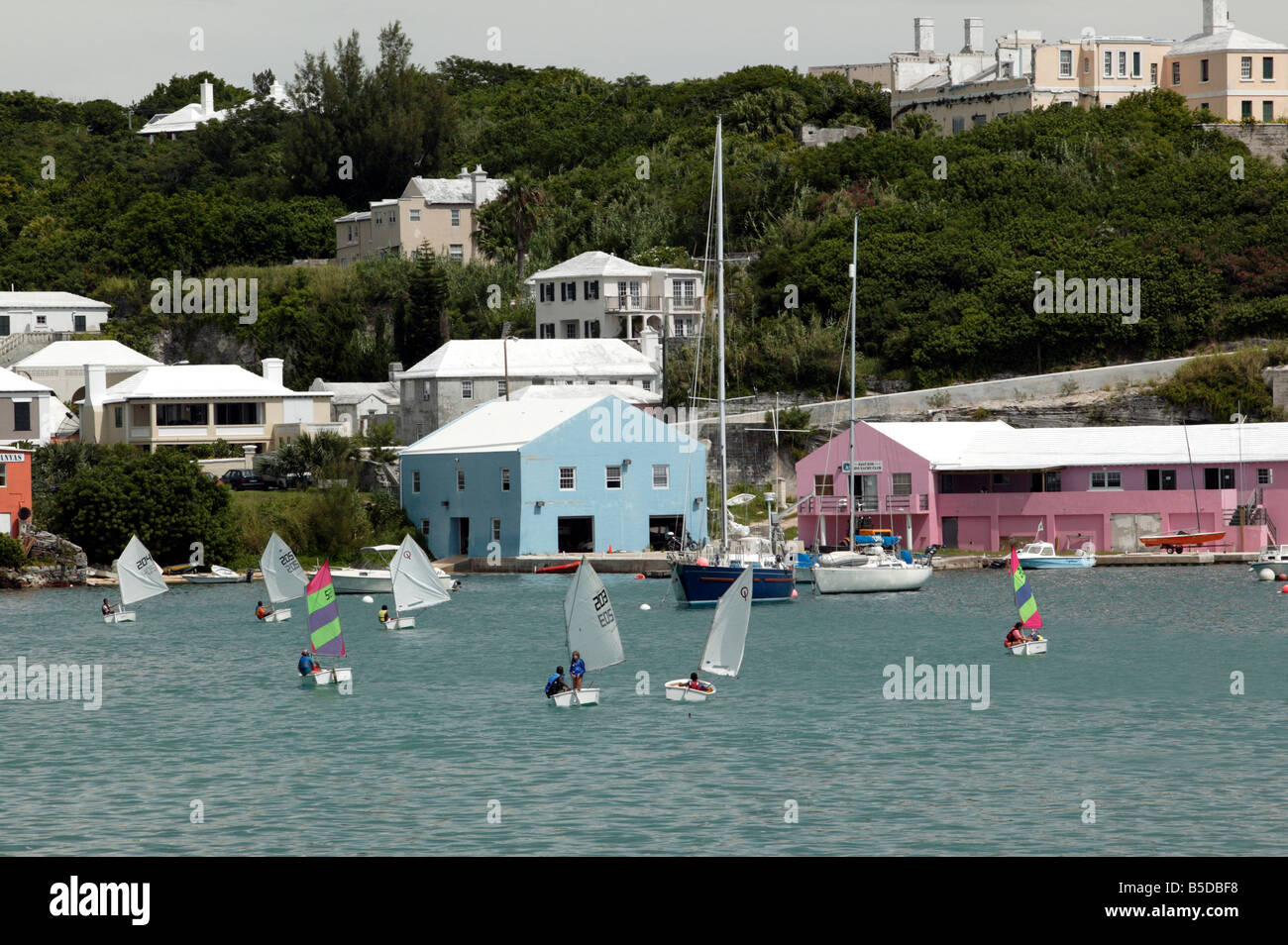 Shot of Kids Dinghy Sailing in a sudden rain shower in St
