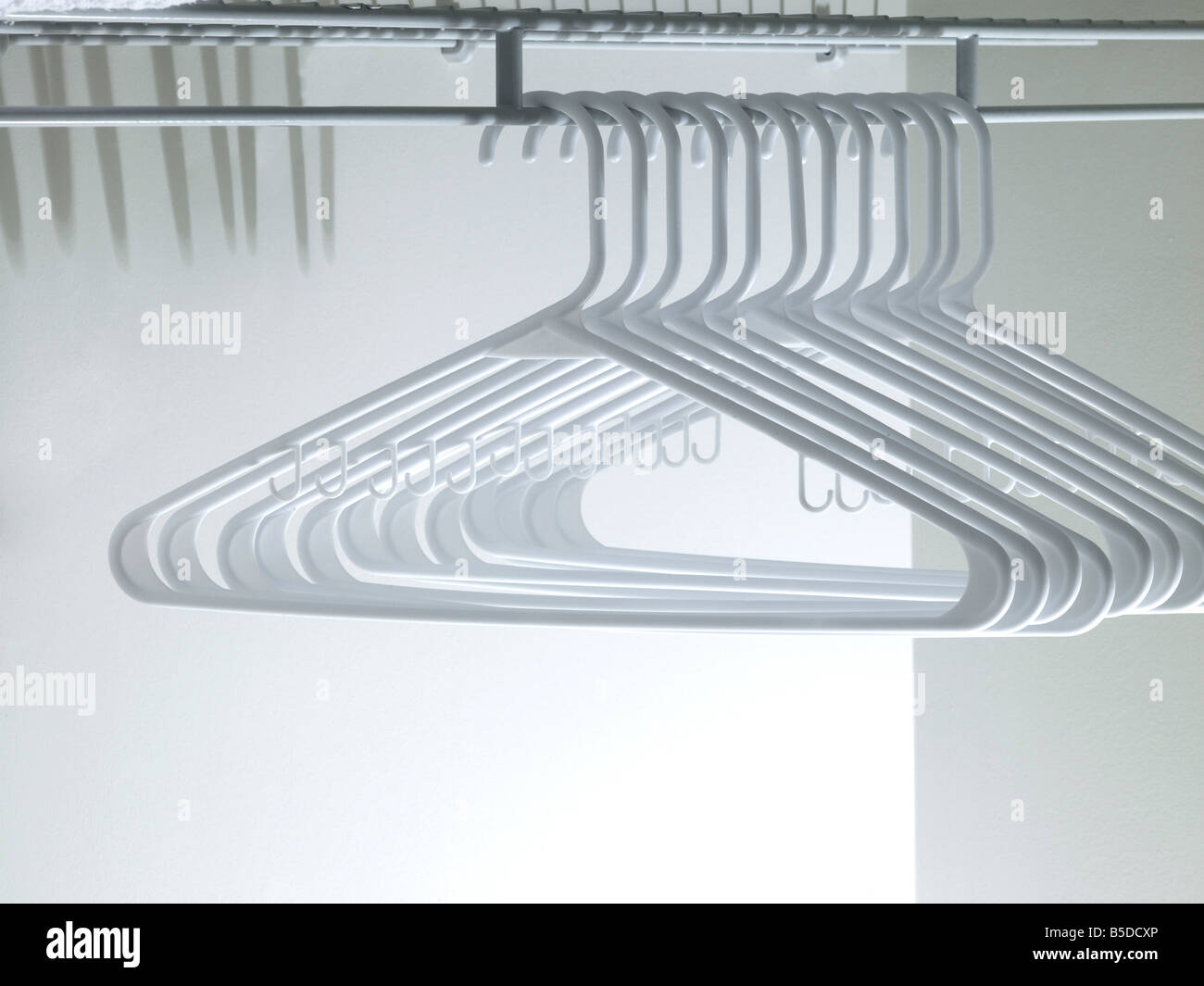 Clothing Hangers In Closet Stock Photo