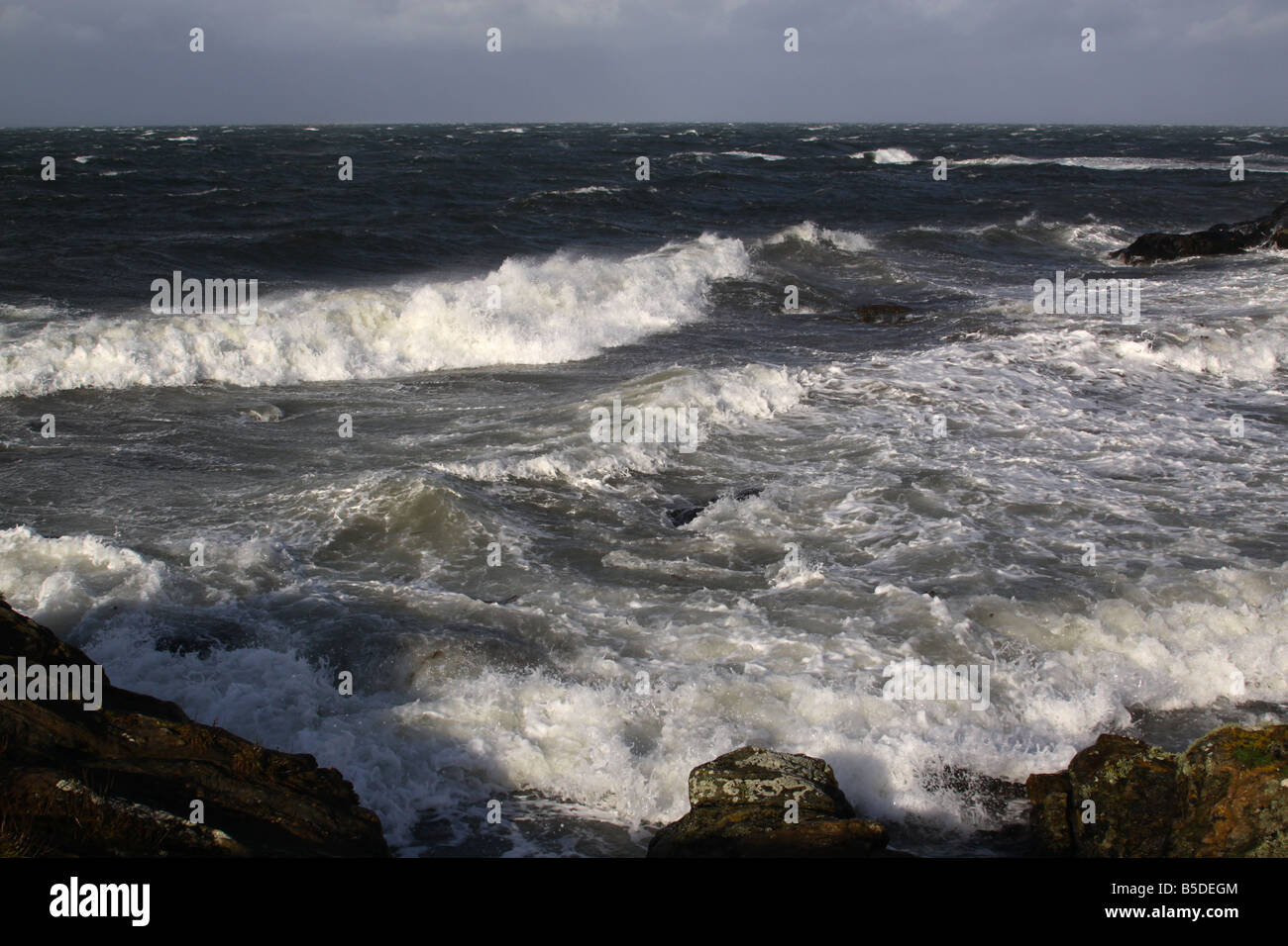 Waves breaking on rocks Stock Photo