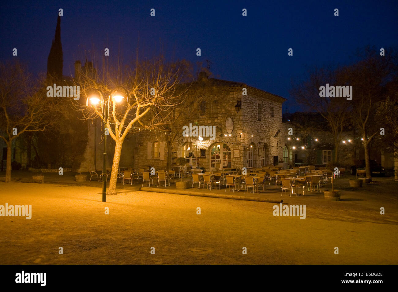 Grignan Village square. Night time twilight.  street lights Horizontal 81130 Grignan Stock Photo