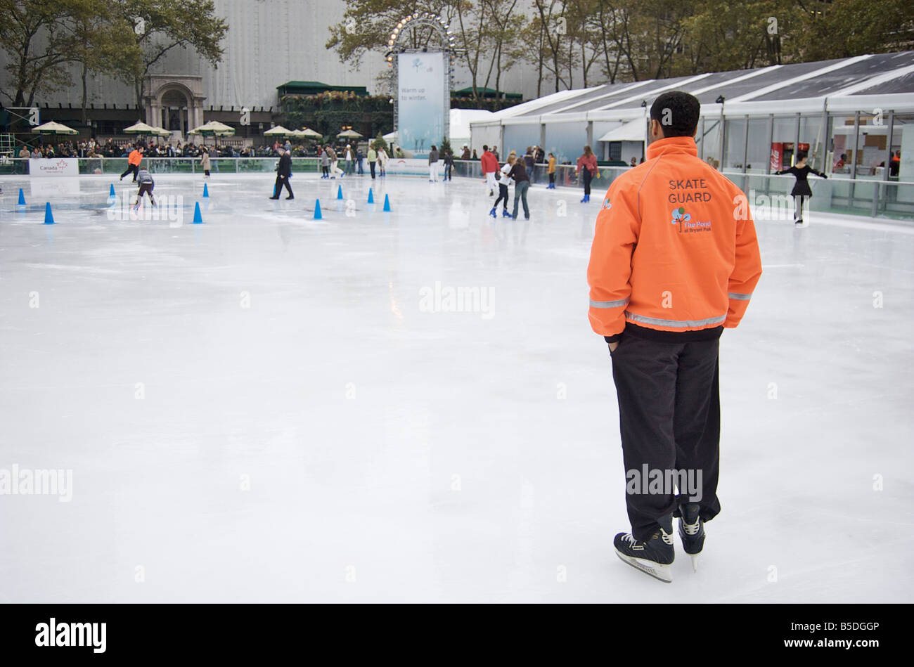 Bryant Park Skate Guard in New York City oversees ice skaters (For