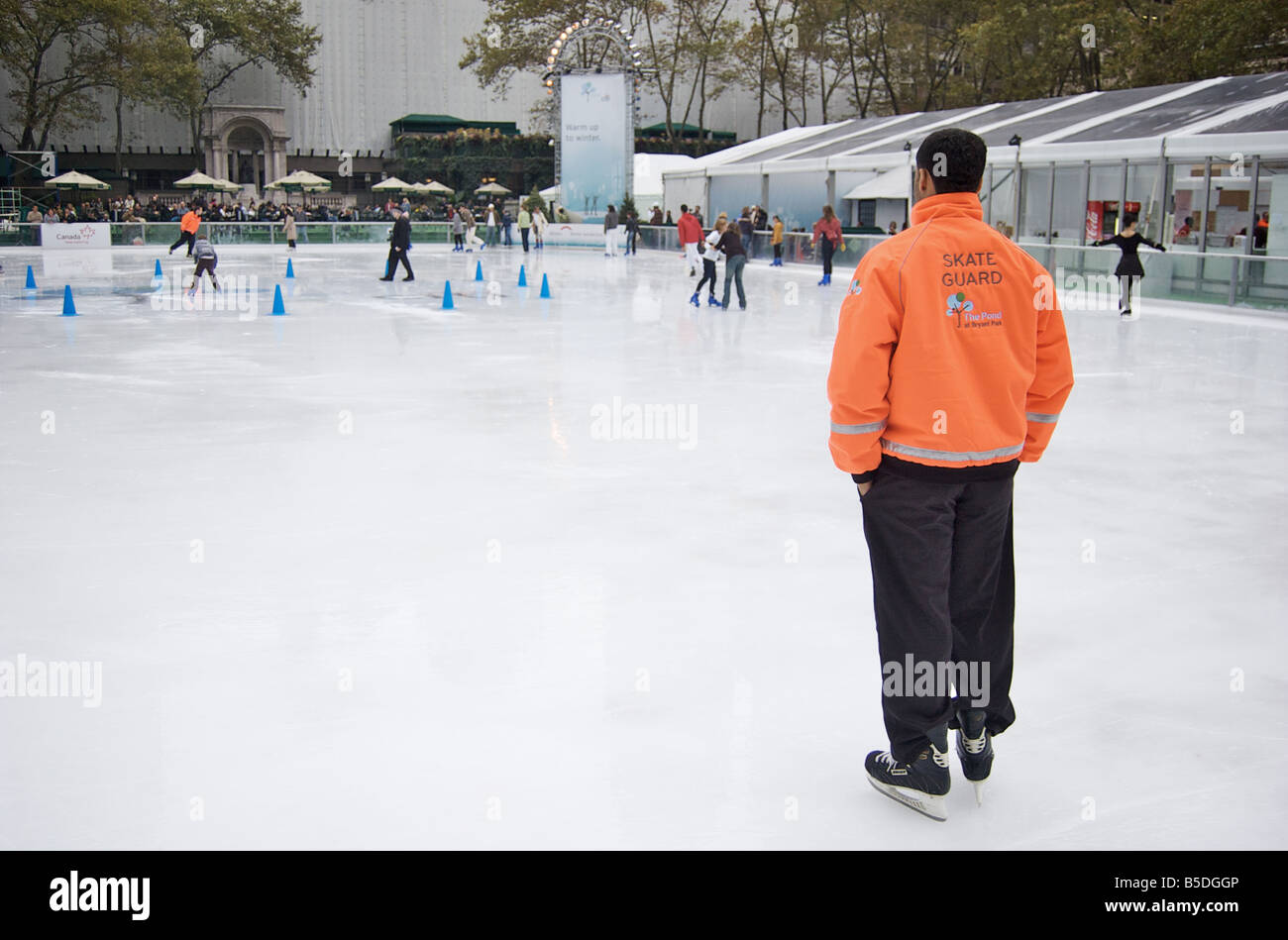 Bryant Park Skate Guard in New York City oversees ice skaters (For Editorial Use Only) Stock Photo