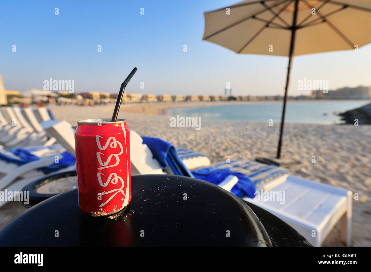 Arabian Coca Cola can on a private beach resort, Ras Al Khaimah, UAE Stock Photo