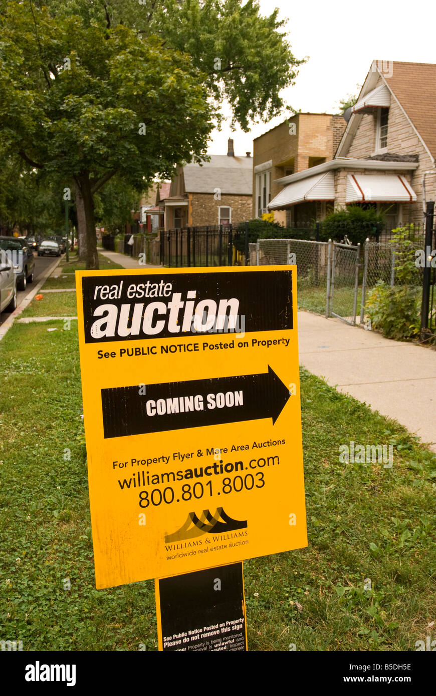 Public auction sign posted outside a foreclosed home in Chicago
