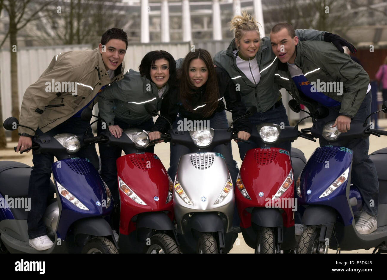 Popstars Hear Say Pop Group March 2001 Kym Marsh Danny Foster Myleene Klass Suzanne Shaw Noel Sullivan posing with motor scooters for a promotion shoot HearSay Stock Photo