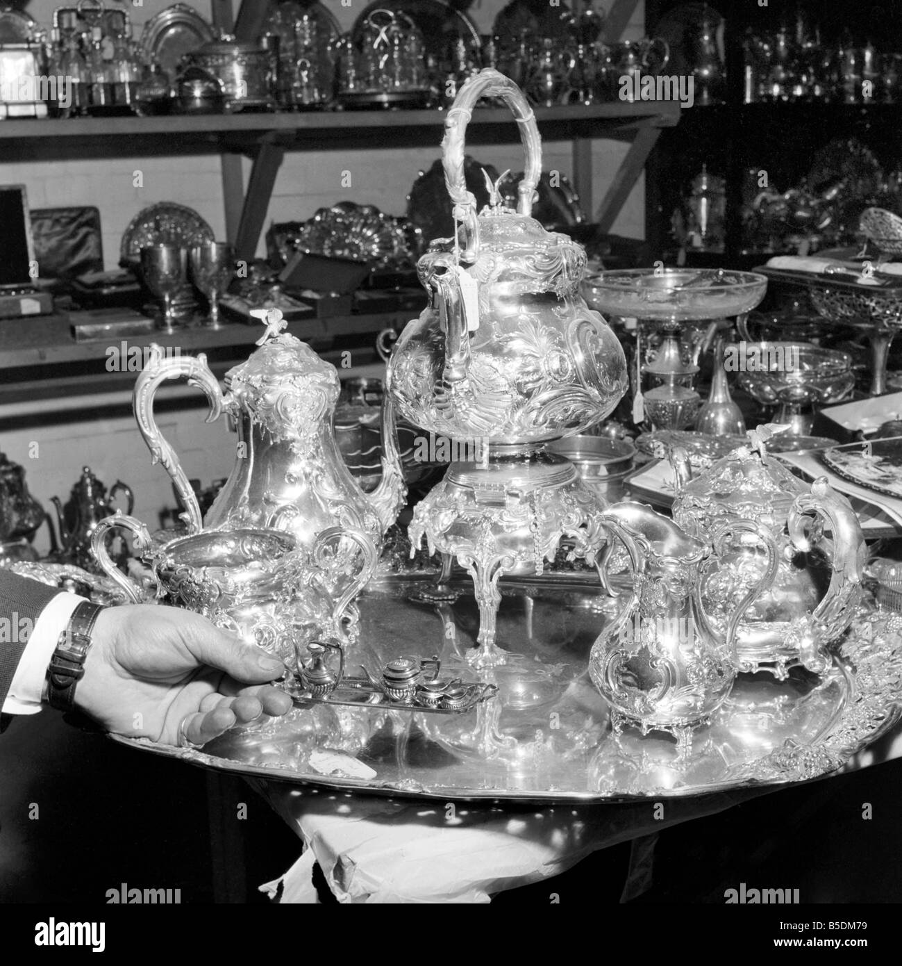 Below Chancery Lane hidden away behind large safe doors, the London Silver Vaults house a seemingly endless number of specialist silverware dealers. There is a massive range of goods, from candelabras and cutlery to fine jewellery. December 1956 Stock Photo