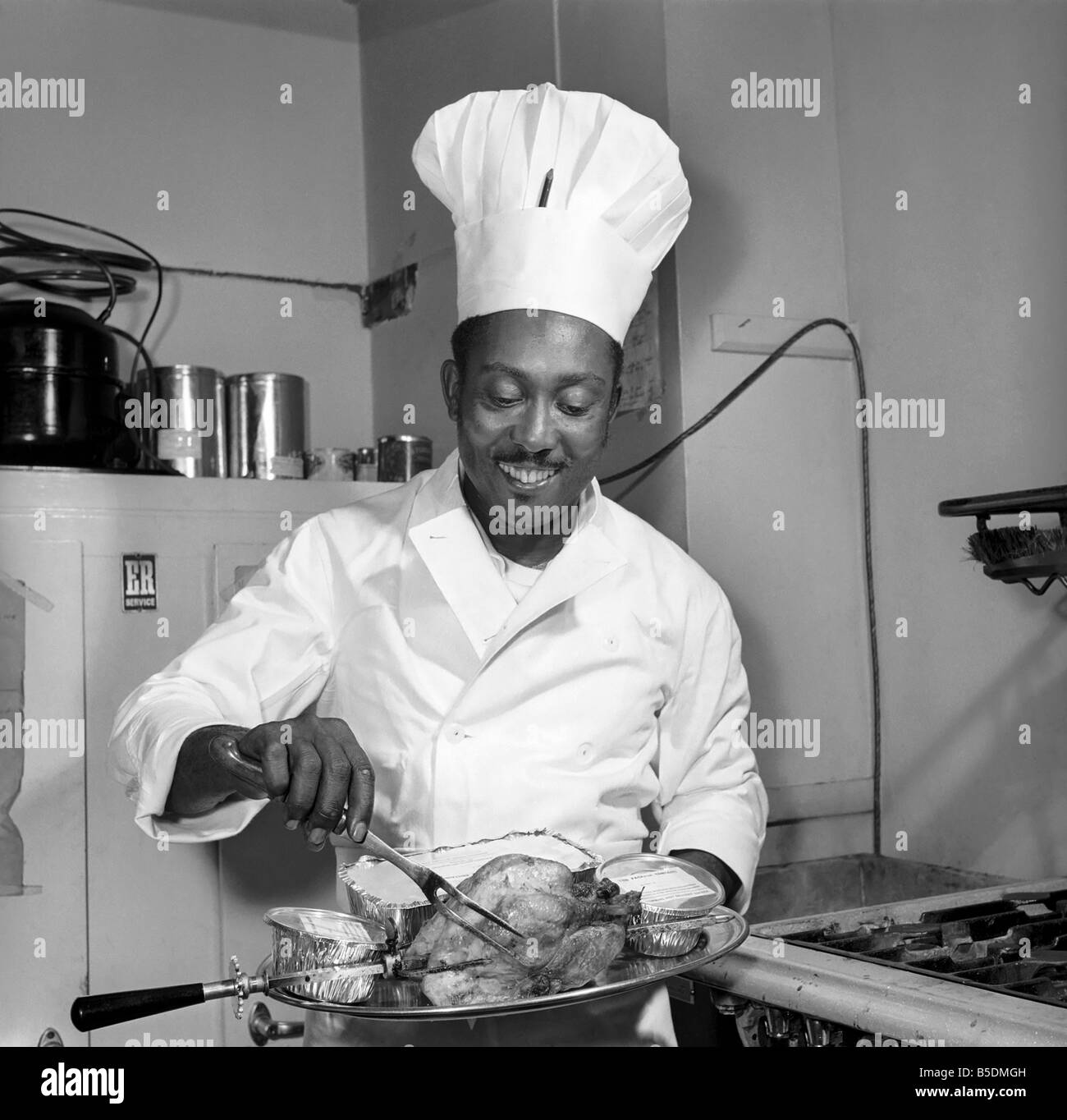 The Chef at the Romains Buttery seen here in the kitchen preparing meals that are ordered over the telephone and biked to the clients address. Circa 1959 Stock Photo