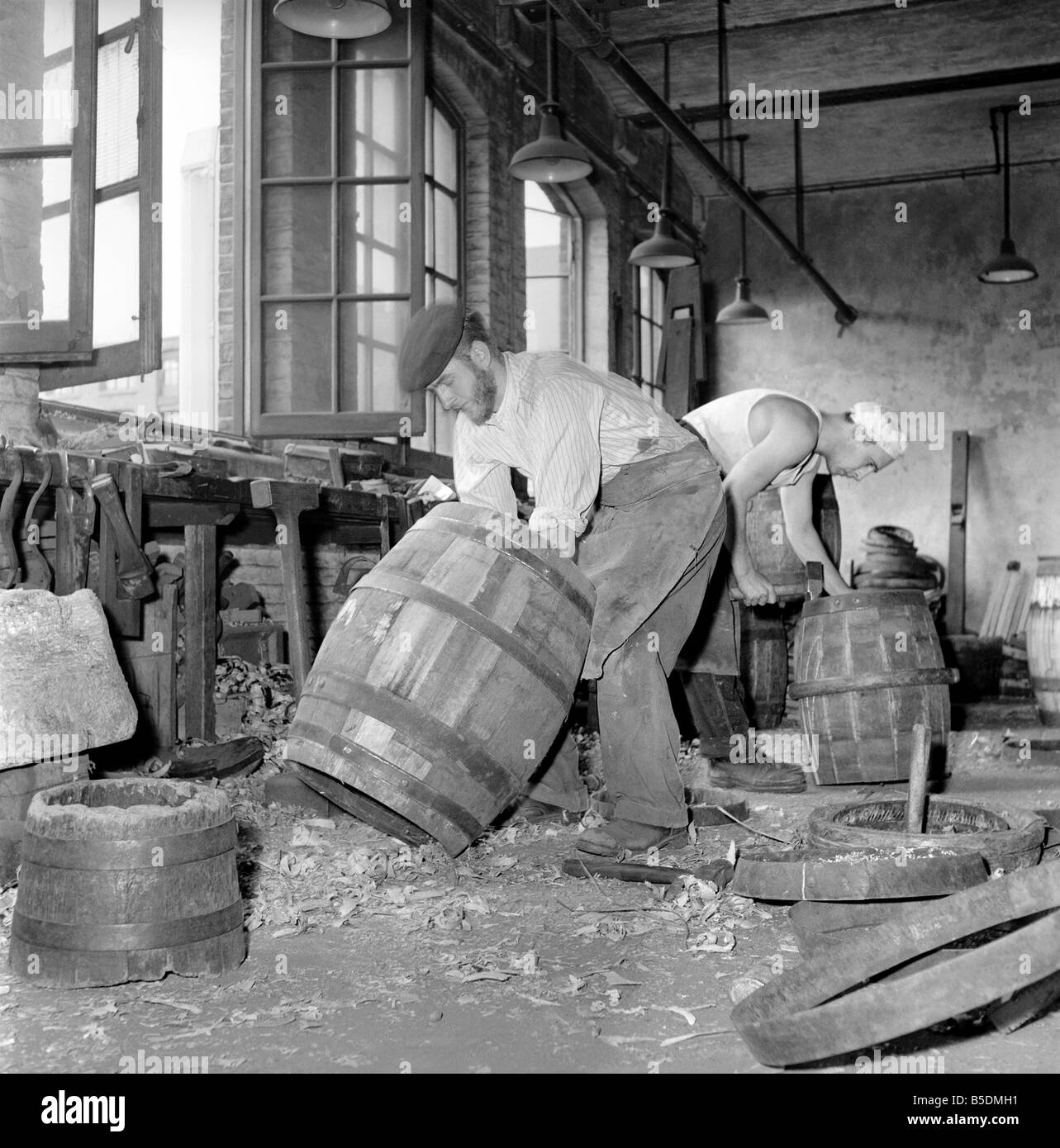 Coopers making beer barrels at the Whitbread brewery. October 1958