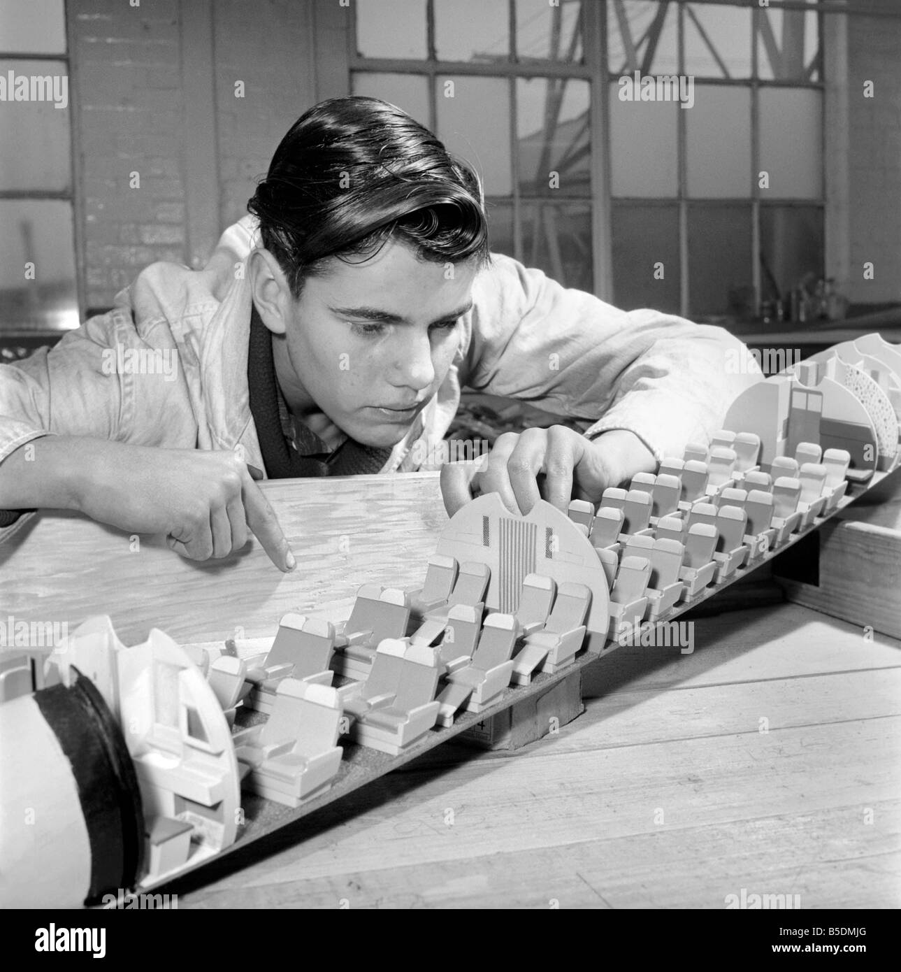 Factory where model aircraft for the travel agents are made. Men making