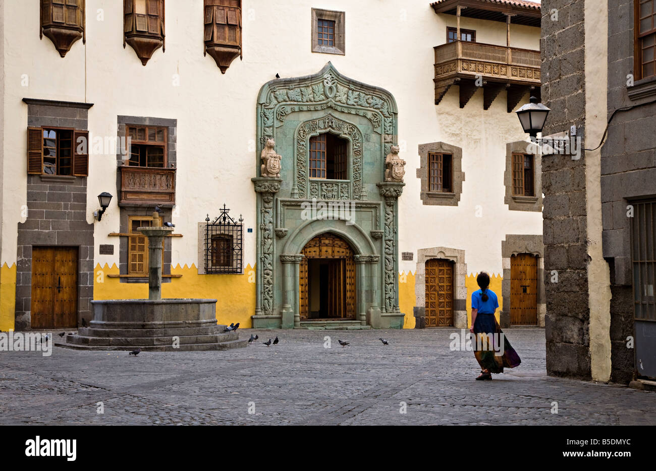 Woman outside the Biblioteca Colombina library Casa de Colon old part of town Las Palmas Gran Canaria Spain Stock Photo