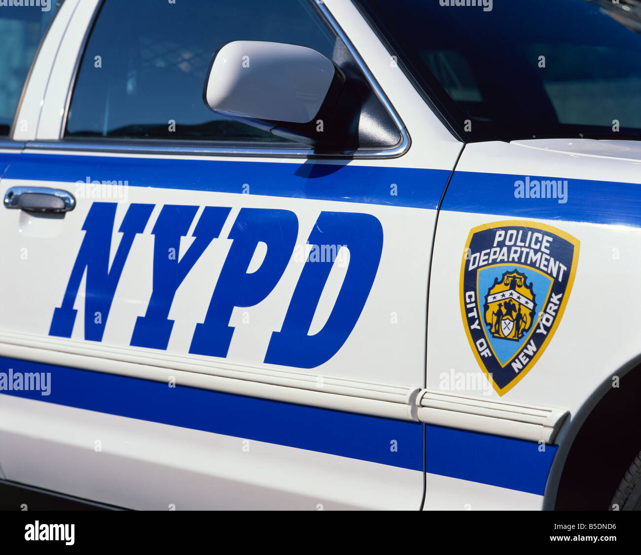 Close-up of police car with insignia of the City of New York Police Department, NYPD, on the side, in New York, USA Stock Photo