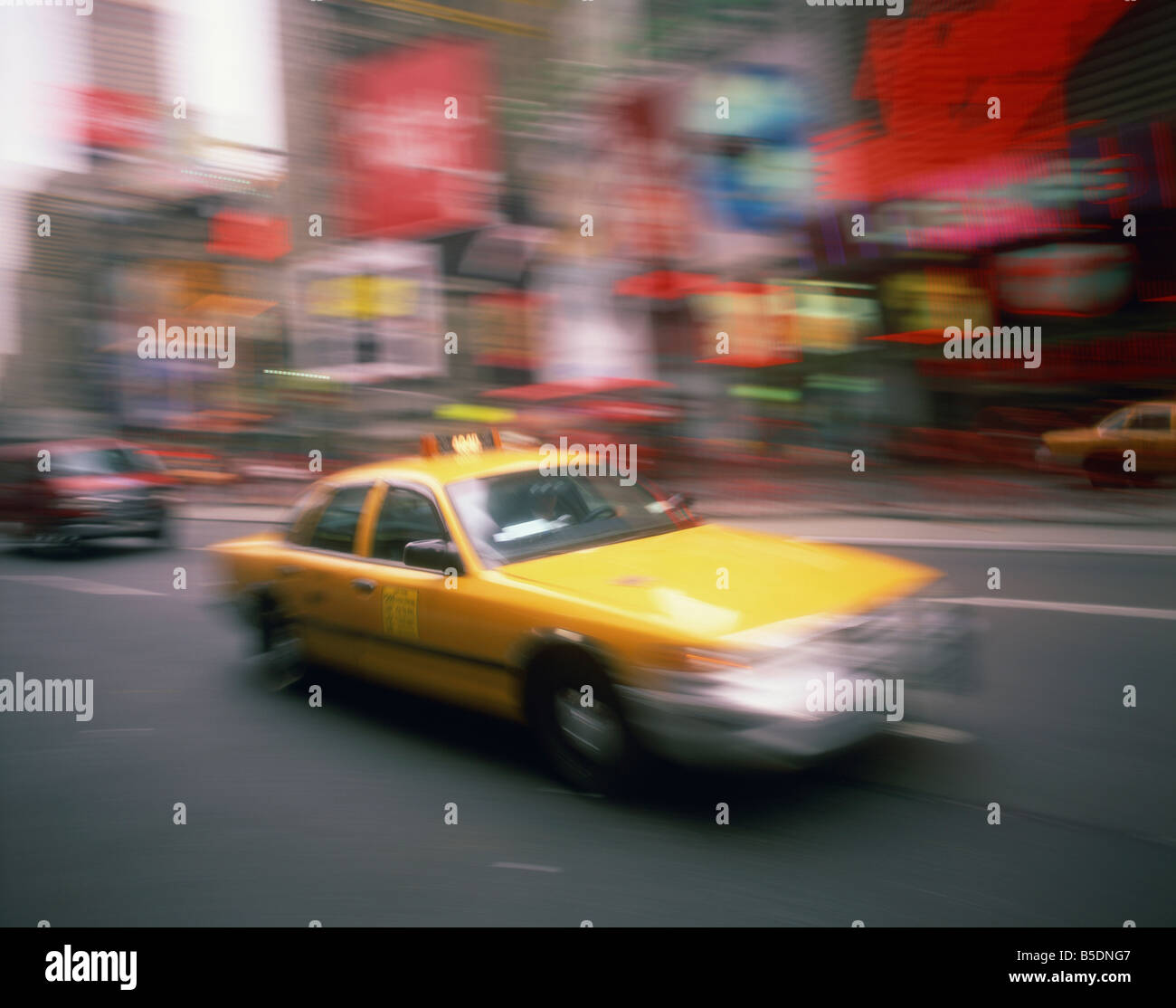 Yellow cab on the street in Times Square in New York United States of America North America Stock Photo