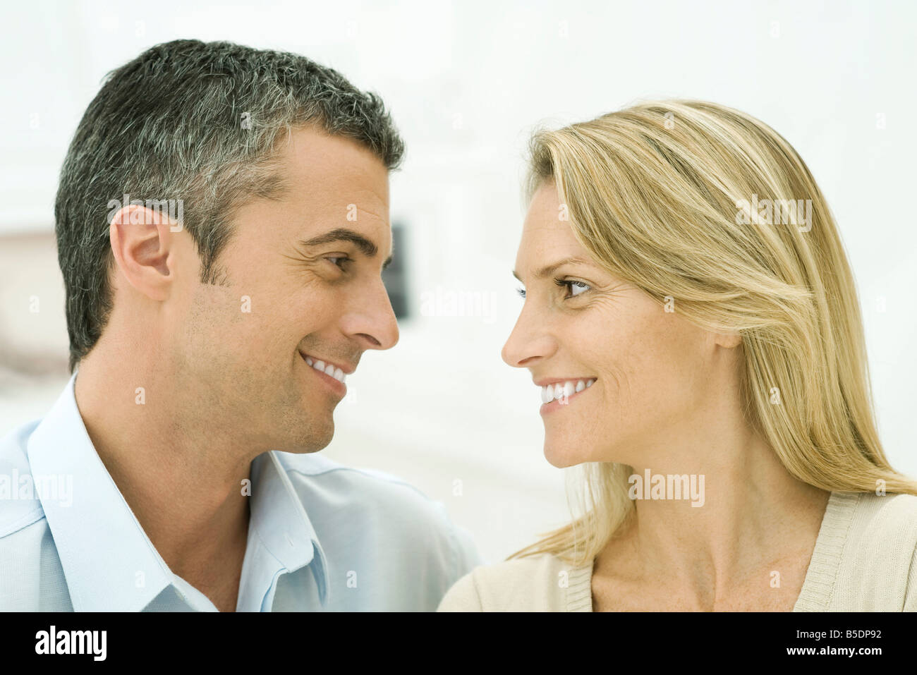 Couple smiling at each other Stock Photo