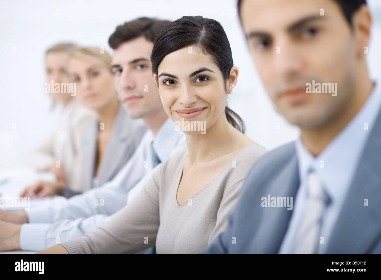 Three diverse young professionals standing hi-res stock photography and ...
