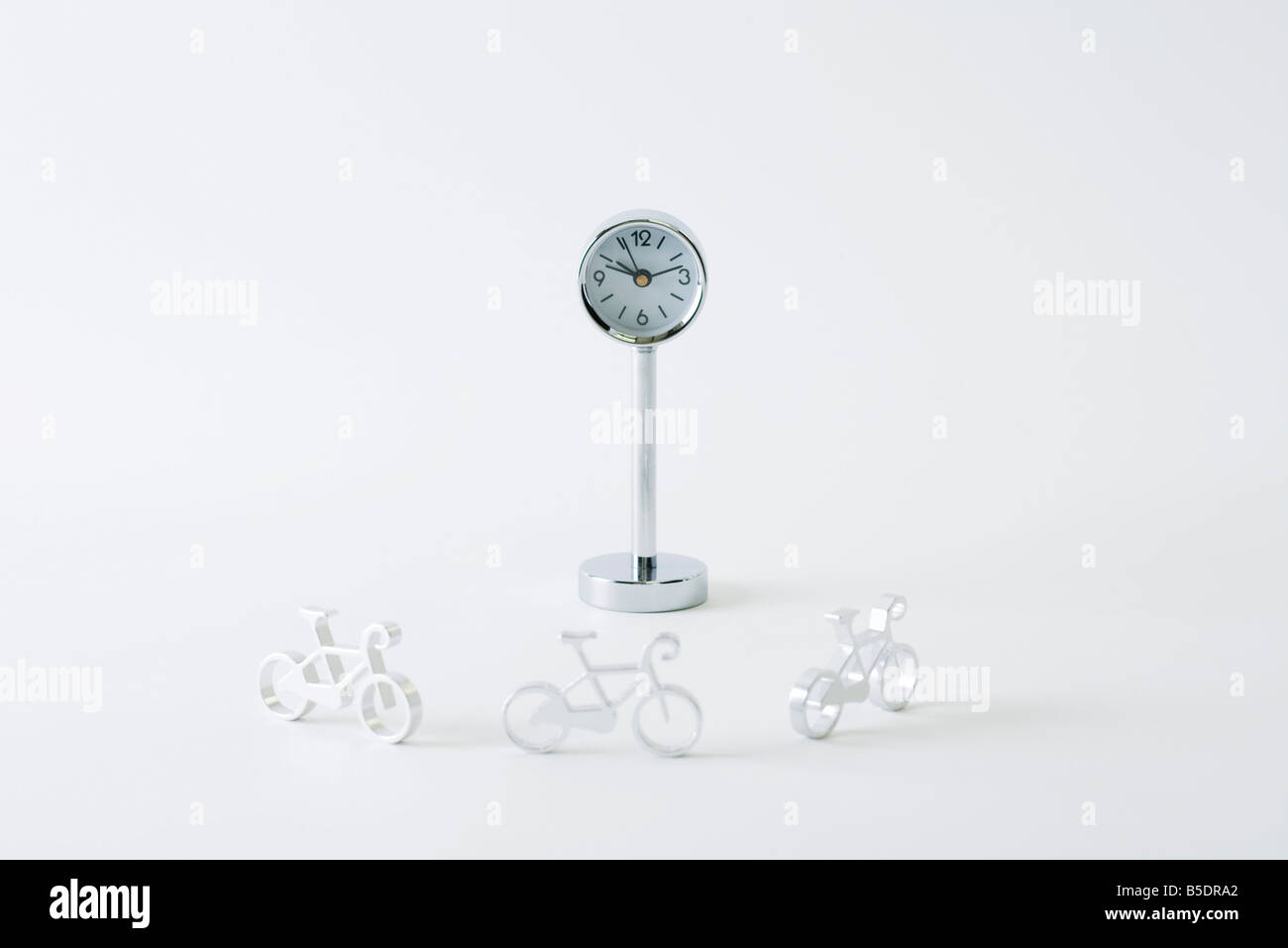 Miniature bicycles riding around clock Stock Photo Alamy