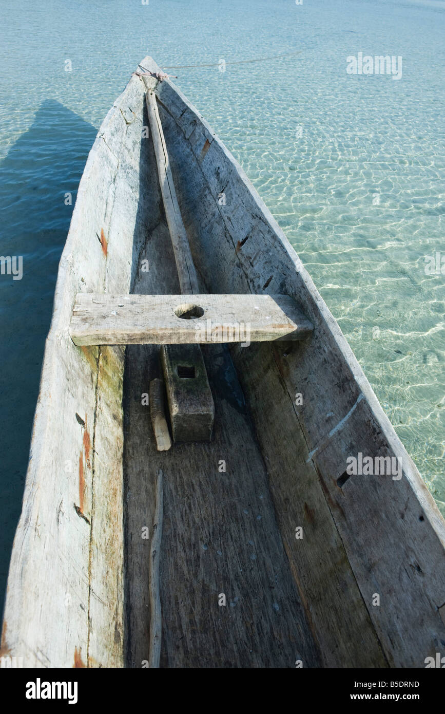 Wooden canoe in shallow water, cropped Stock Photo Alamy