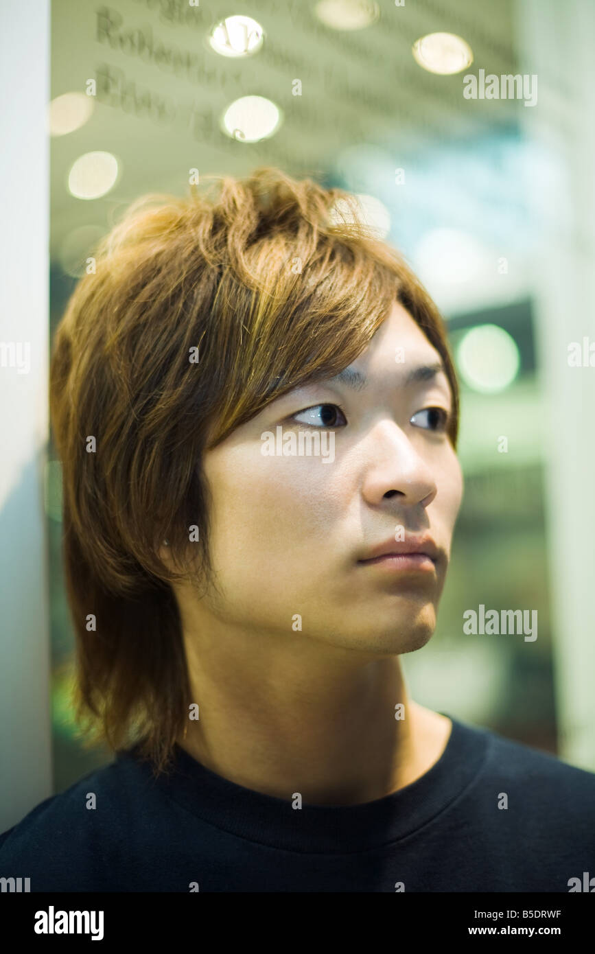 Young man looking away, portrait Stock Photo