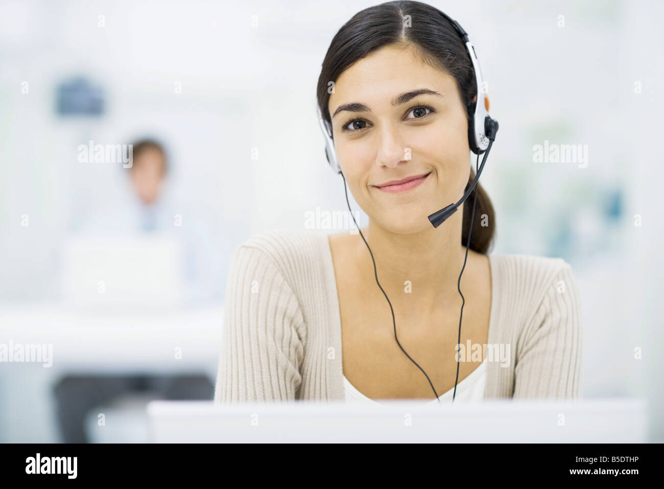 Young female telemarketer Stock Photo