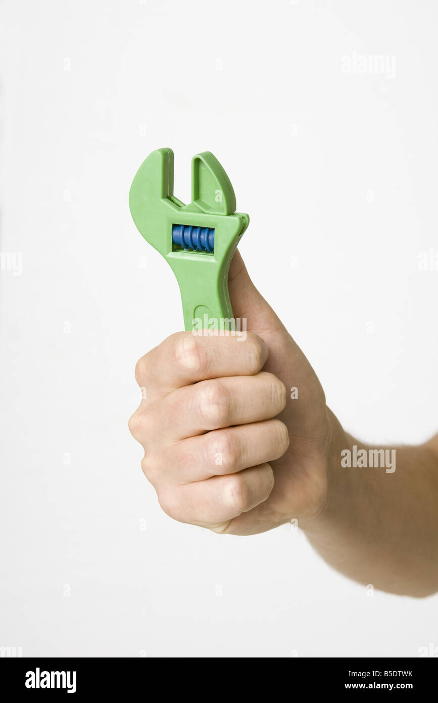 Hand holding wrench Stock Photo