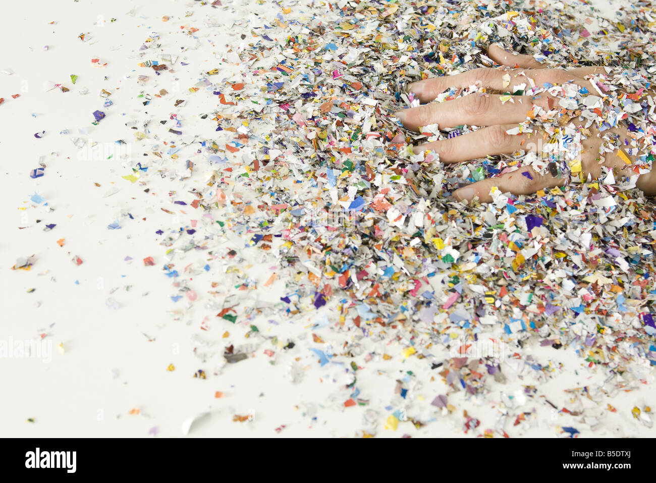 Hand covered in confetti Stock Photo