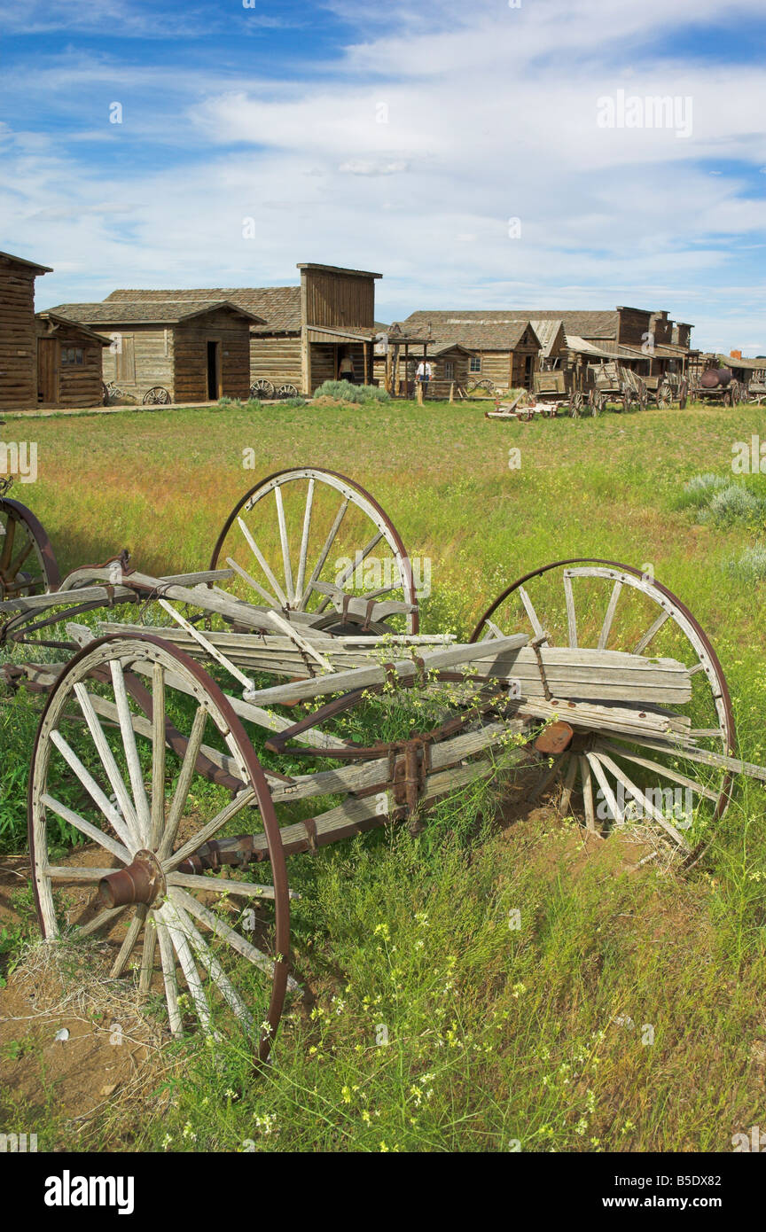 Old western wagons, restored storefronts, homes and saloons from the pioneering days of the Wild West at Cody, Montana, USA Stock Photo
