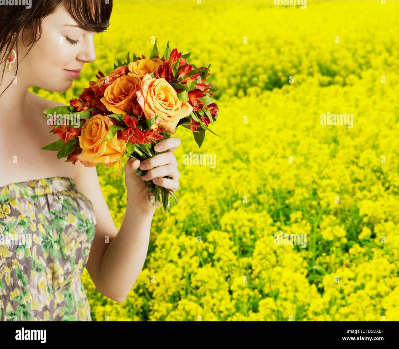 Young Woman Smelling Flowers Stock Photo Alamy