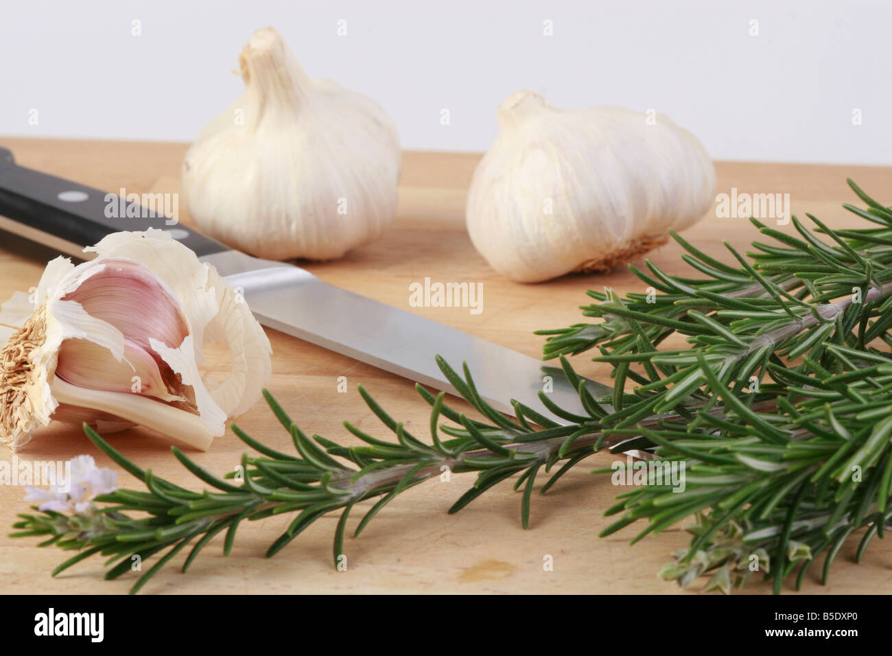 garlic rosemary knife Stock Photo
